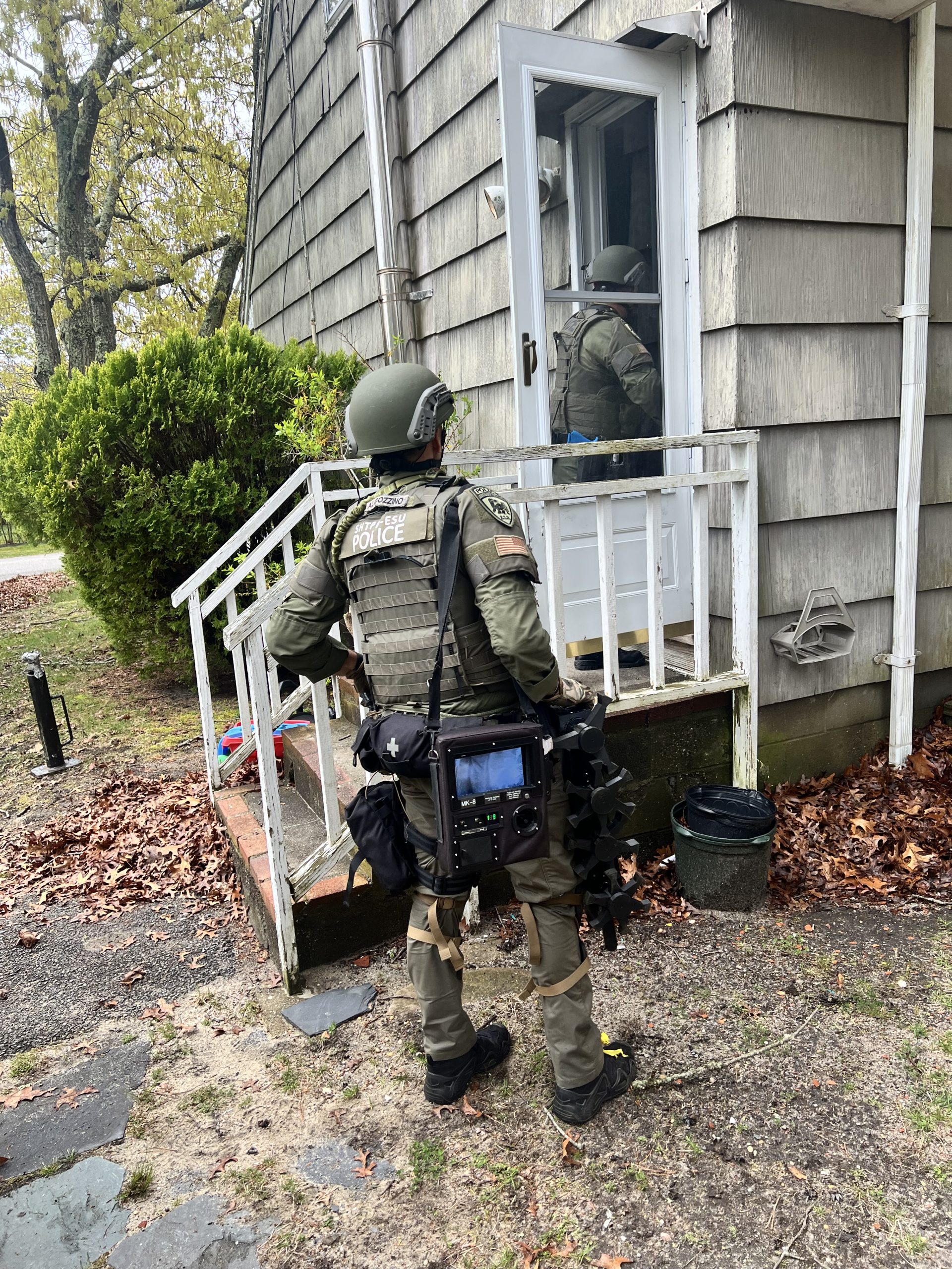 Tactical team entering home